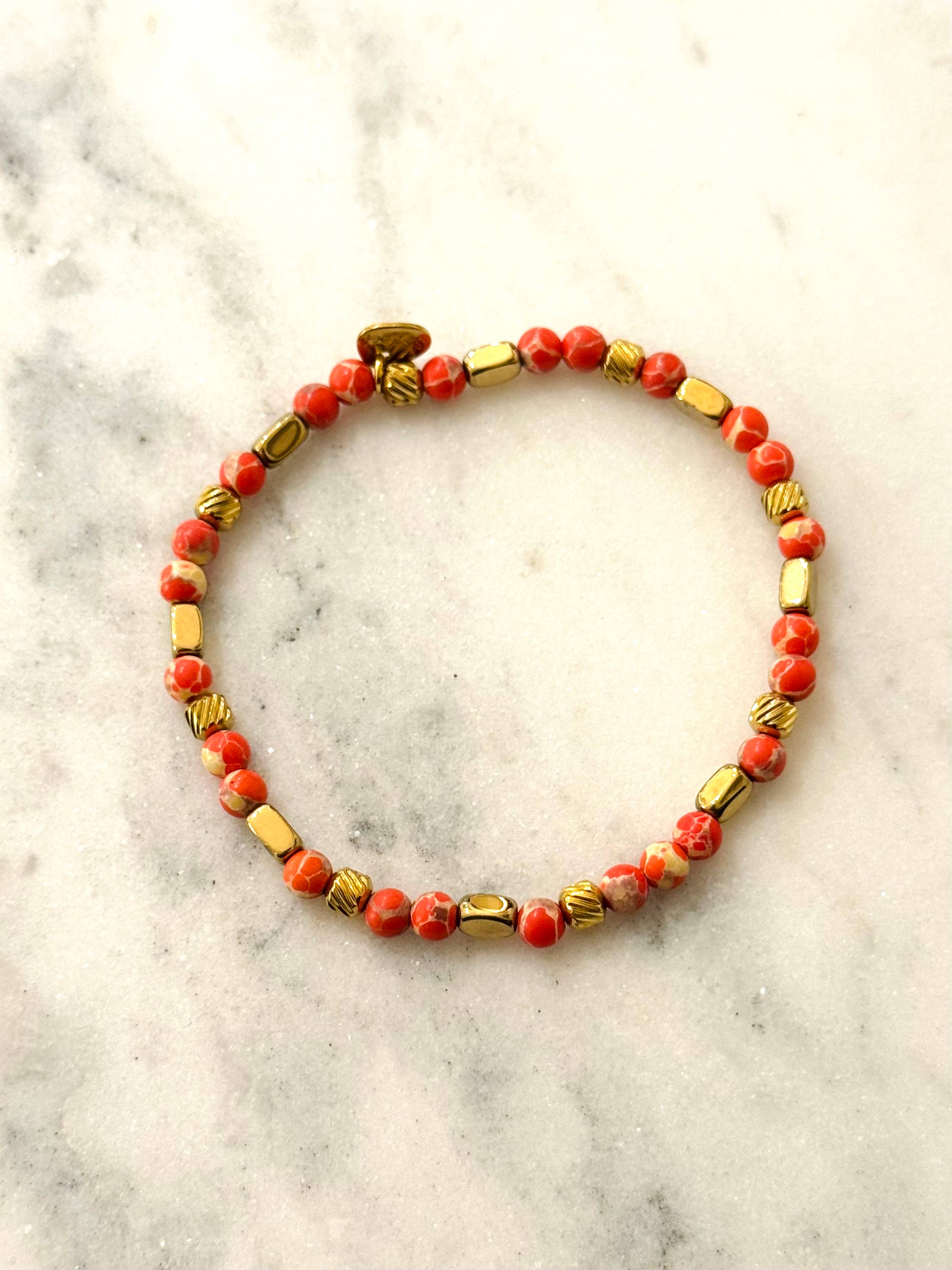 Pulsera Emilia Coral. Acero inoxidable y piedras naturales Unakite